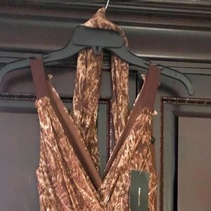 New with Tags: Beautiful Mahogany dress. Zipper on side & wrap around dress.